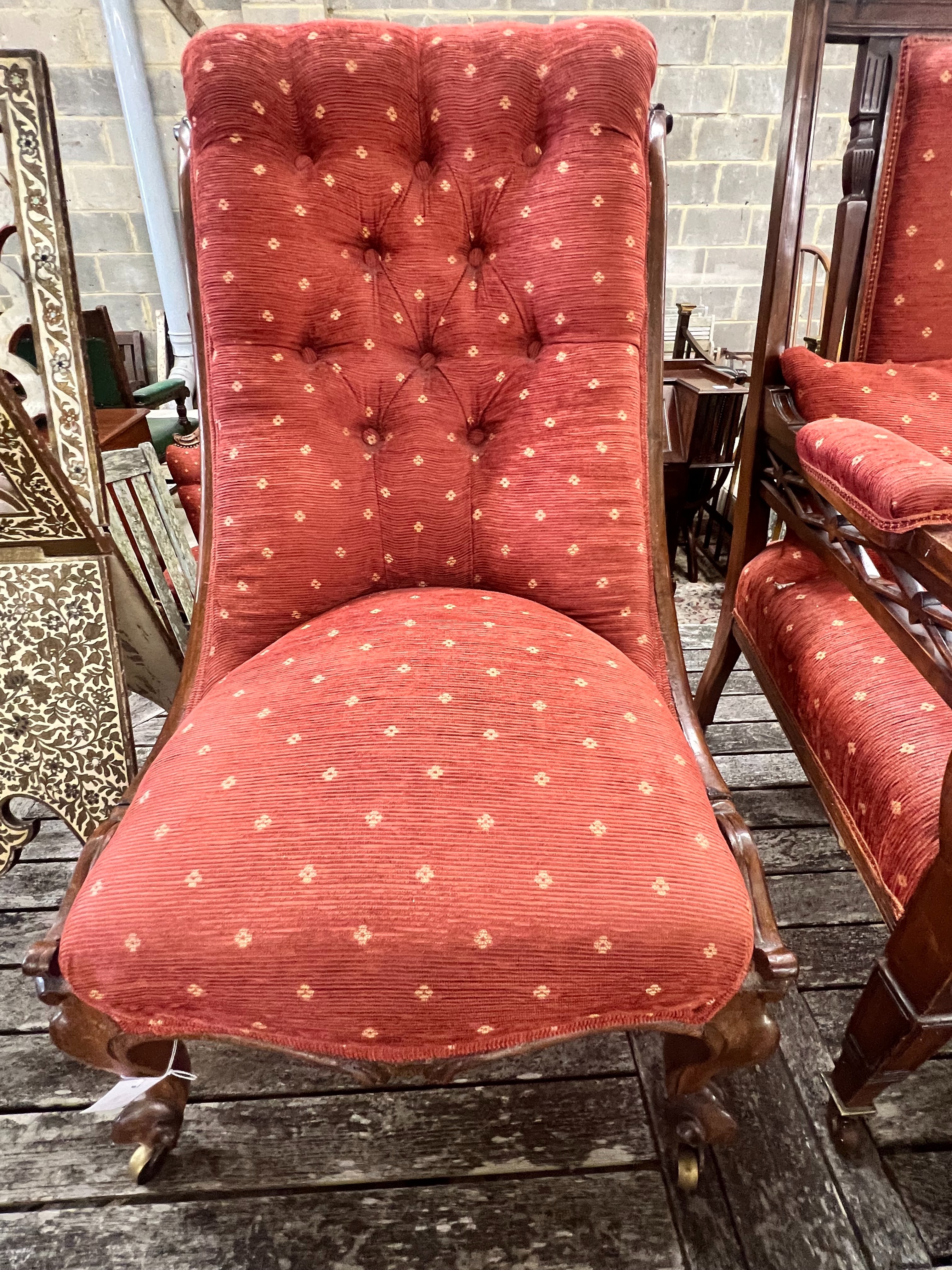 A late Victorian mahogany open armchair and an early Victorian rosewood nursing chair